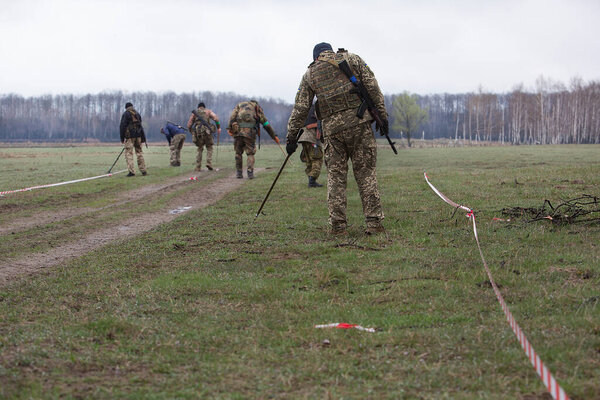 Berezivka, UKRAINE - APRIL 21, 2022: War of Russia against Ukraine. Ukrainian sappers clear the territory after it was occupied by the Russian military, APRIL 21, 2022.