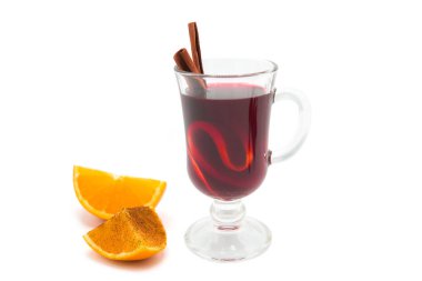 Hot mulled wine for winter with spices isolated on white background. Closeup. Copy space.