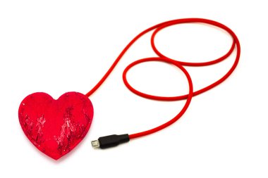 Red heart connected to usb cable isolated on white background.