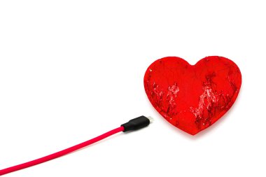 Red heart connected to usb cable isolated on white background.