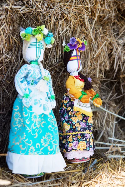 Motanka dolls in a haystack. Handmade. Traditional Ukrainian doll.