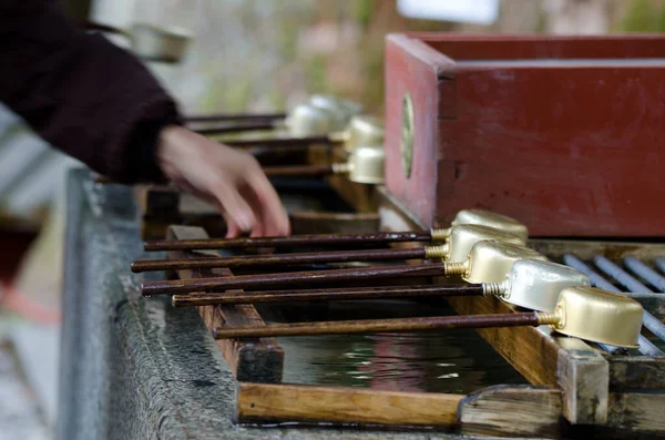 stock image Dippers prepared for the ceremonial purification rite known as temizu or chozu. Tosho-gu Shrine. Nikko. Tochigi Prefecture. Japan.