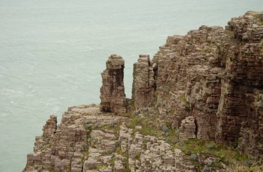 Detail of a sea cliff. Cape Frehel. Cotes-d'Armor department. Brittany. France. clipart