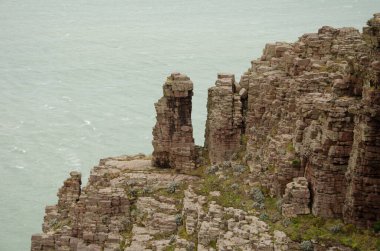 Detail of a sea cliff. Cape Frehel. Cotes-d'Armor department. Brittany. France. clipart