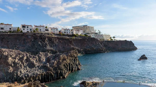 stock image View of buildings on a volcanic cliff coast of Tenerife. Canary Islands, Spain