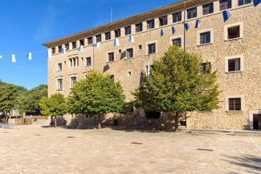 Facade of the main building of the Lluc sanctuary on Majorca. Balearic Islands, Spain clipart