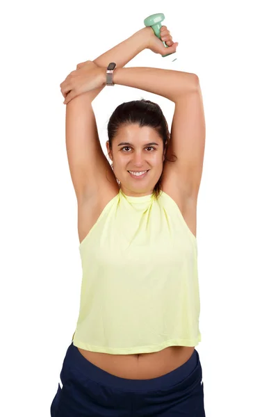 白い背景のジムでのトレーニングセッション前に腕を上げて伸ばすスポーティな女性 高品質の写真 — ストック写真
