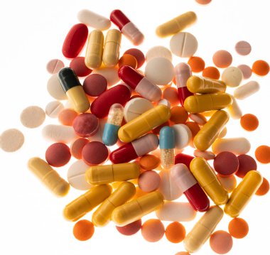 Pile of different medicaments pills, capsules, isolated on white background