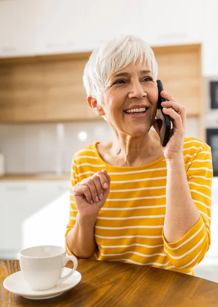 Cheerful Mature Woman Talking Mobile Phone Drinking Coffee Home Dining — Stock Photo, Image