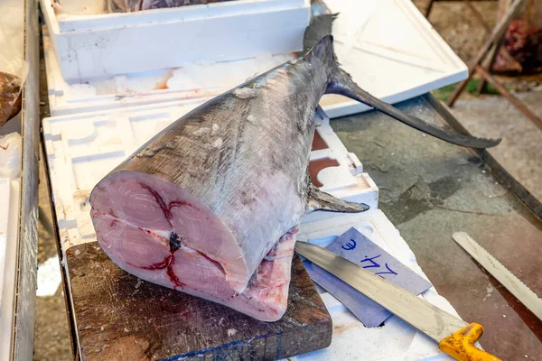 stock image Big piece of raw swordfish on a cutting board at farmer market, Nikiti, Sithonia, Greece. Selective focus