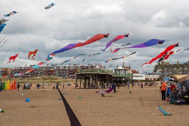 St Annes Lancashire United Kingdom August 30th 2025 St Annes Kite Festival Attendees prepare kites for flight at the annual festival