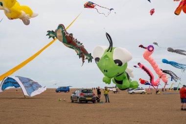 St Annes Lancashire United Kingdom August 30th 2025 St Annes Kite Festival Attendees prepare kites for flight at the annual festival