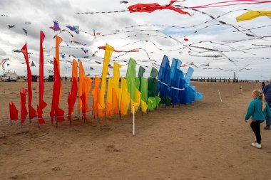 St Annes Lancashire United Kingdom August 30th 2025 St Annes Kite Festival Attendees prepare kites for flight at the annual festival