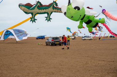 St Annes Lancashire United Kingdom August 30th 2025 St Annes Kite Festival Attendees prepare kites for flight at the annual festival