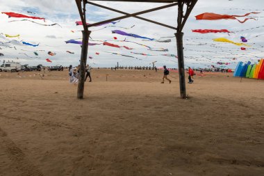St Annes Lancashire United Kingdom August 30th 2025 St Annes Kite Festival Attendees prepare kites for flight at the annual festival