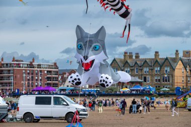 St Annes Lancashire United Kingdom August 30th 2025 St Annes Kite Festival Attendees prepare kites for flight at the annual festival