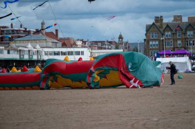 St Annes Lancashire, United Kingdom, August 30th 2025, St Annes Kite Festival. Attendees prepare kites for flight at the annual festival