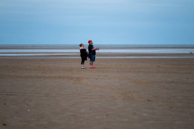 St Annes Lancashire, United Kingdom, August 30th 2025, St Annes Kite Festival. Attendees prepare kites for flight at the annual festival