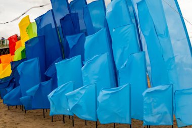 Bright flags waving in the wind, symbolizing celebration, freedom, and progress.