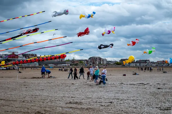 St Annes Lancashire, United Kingdom, August 30th 2025, St Annes Kite Festival. Attendees prepare kites for flight at the annual festival