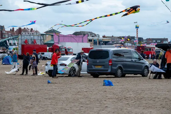 St Annes Lancashire, United Kingdom, August 30th 2025, St Annes Kite Festival. Attendees prepare kites for flight at the annual festival