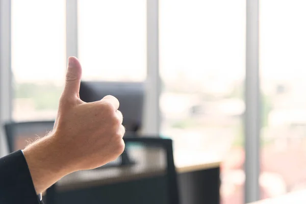 Stock image Successful business concept. Businessman show thumbs up to employees in the modern meeting room