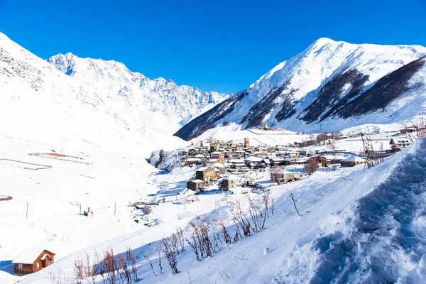 stock image Small village in winter with Caucasus mountain. Ushguli famous landmark in Svaneti Georgia is one of the highest settlements in Europe.