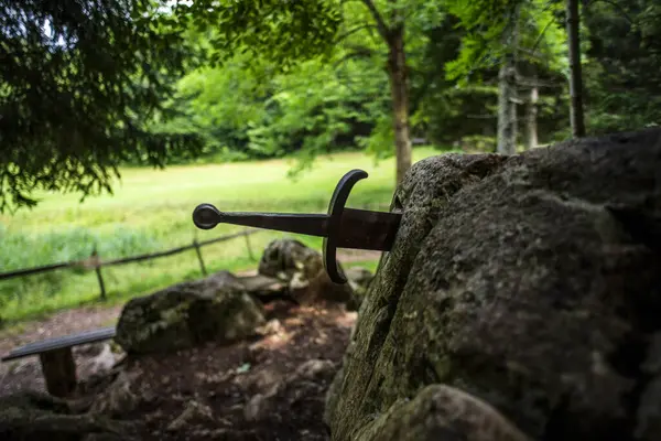 the sword in the stone old sword stuck in a rock in Tonezza del Cimone Vicenza Veneto Italy