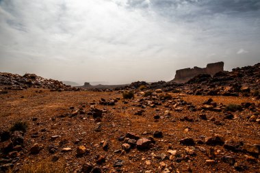 panorama of the Moroccan Atlas mountain peaks with desert valleys and orange rocks among the Berber trails in Jebel Saghro near Ouarzazate Marrakech in Morocco clipart