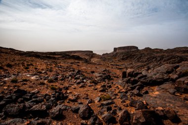 close up of rocks and rock formations among the peaks of the Moroccan Atlas between desert valleys and Berber lands in Jebel Saghro near Ouarzazate in Marrakech Morocco clipart