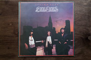 Lublin, Poland. 18 January 2023.Bee Gees Living Eyes record on dark wooden table