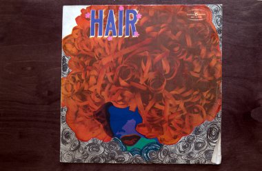 Lublin, Poland. 18 January 2023.Hair music hall soundtrack long play on dark wooden table