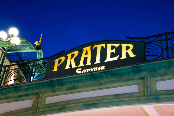 Vienna, Austria 01 October 2023 lit prater sign at the entrance to the Prater amusement park at night