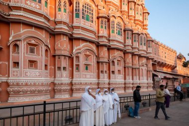 Jaipur, India 16 February 2024. Hawa Mahal is a palace built from red and pink sandstone with exterior inspired by honeycomb and intricate latticework clipart