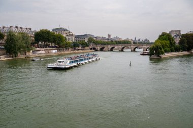 Paris, France August 15 2024 tourist ferry on River Seine in the city centre near Ile de la Cite clipart