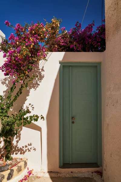 Stock image Wooden Door Entrance with Flowers - Emporio Village, Santorini Island, Greece