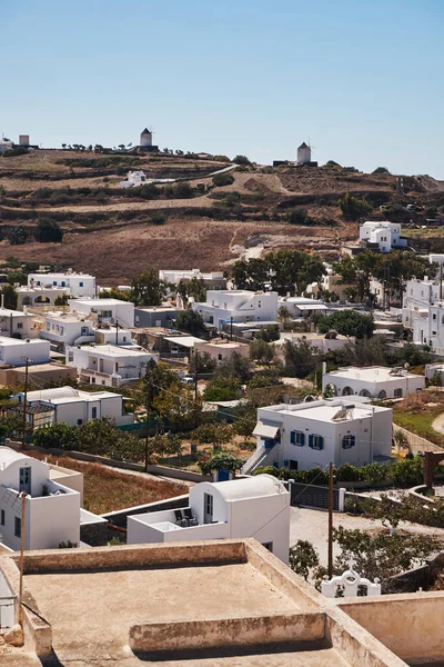 stock image Panoramic Aerial View from Emporio Village with Windmills on a Hill in Santorini Island, Greece - Traditional White Houses in the Caldera Cliffs