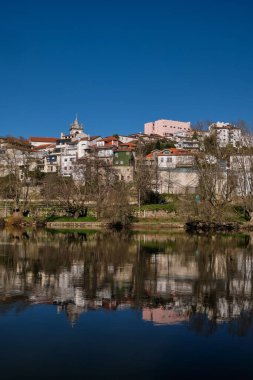 Panoramic View of the Amarante Traditional Houses with a serene reflex over Tamega River, Portugal