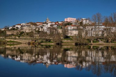 Panoramic View of the Amarante Traditional Houses with a serene reflex over Tamega River, Portugal