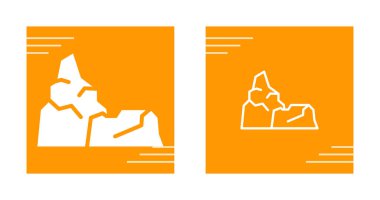 Turuncu arkaplanda soyut kayalık dağ şekilleri