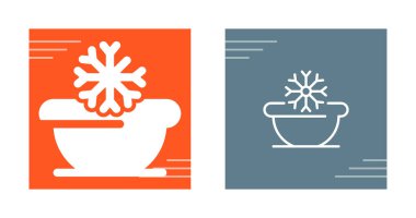 Two simple snowflake icons in contrasting colored backgrounds