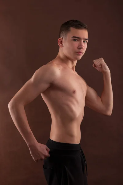 Handsome Muscular Shirtless Adolescent Boy Flexing Muscles — Zdjęcie stockowe