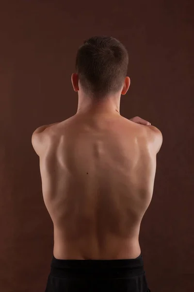 Handsome Muscular Shirtless Adolescent Boy Flexing Muscles Royaltyfria Stockbilder
