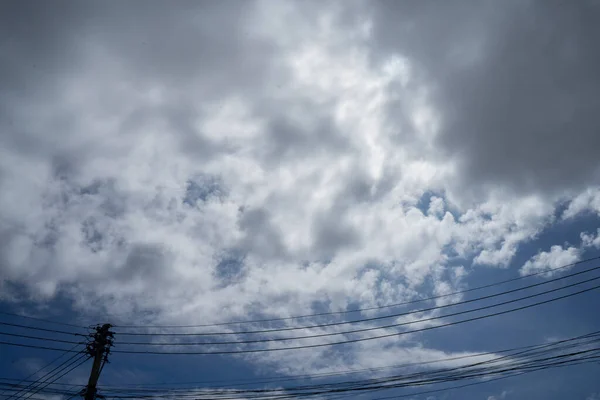 electric tower and power line on sky and black clouds. Filmed in Chiang mai City ,Thailand