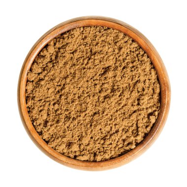 Tahta bir kasede zencefilli kek baharatı. Geleneksel zencefilli ekmek baharatı karışımı, ince tarçın, yıldız anason, zencefil, gürz, rezene, kakule, kişniş, anason, karanfil, tüm baharat ve hindistan cevizi içerir..