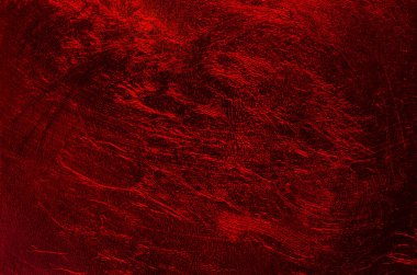 Parlayan metalik plastik film, ve koyu kırmızı zemin, rastgele yapılandırılmış yüzey. Yırtılmış ve cehennem, lav ya da Mars 'ın yüzeyine benzeyen bir dokuyla. Yakından, yukarıdan..