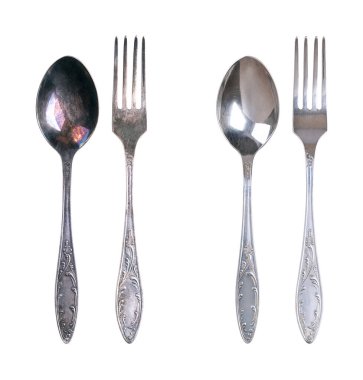 Sterling silver spoon and fork, tarnished and cleaned, isolated from above. On the left side spoon and fork with dark layers of corrosion, and on the right side same ones after cleaning and polishing. clipart