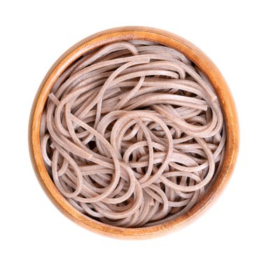 Cold soba noodles in a wooden bowl, isolated from above. Thin Japanese noodles made primarily from buckwheat flour, with wheat flour mixed in. Served chilled with dipping sauce or hot in noodle soup.