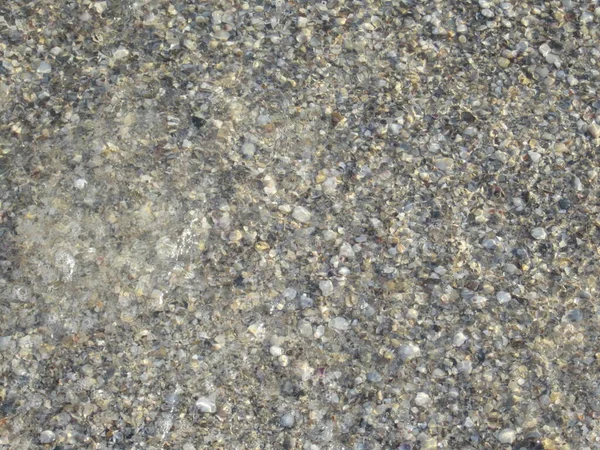 Sahilde Küçük Çakıl Taşları Doğal Arkaplan — Stok fotoğraf