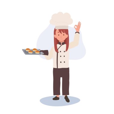 Genç aşçı tamam işareti gösteriyor. Mutlu Aşçı Tamam İmzalıyor ve diğer elinde taze pişmiş çörekleri tutuyor.